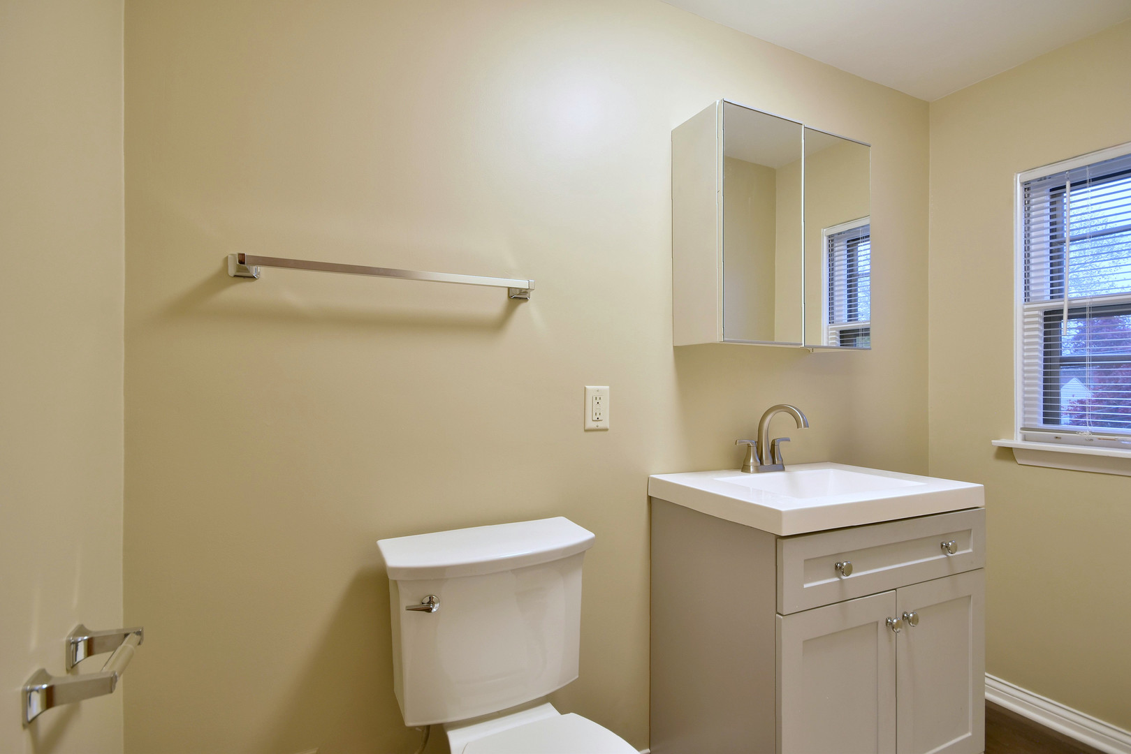 632 Bryan Street Elmhurst, IL 60126 - Photo 20 of 33 a bathroom with a sink a toilet and a mirror