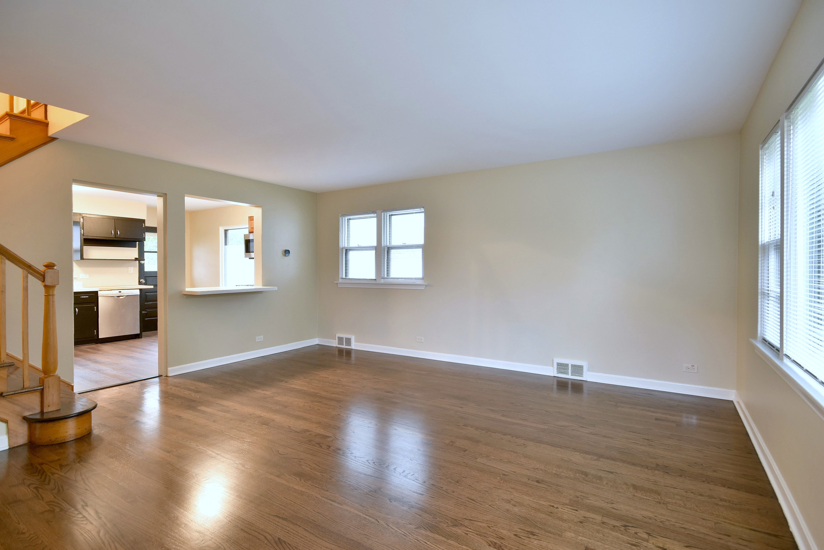 632 Bryan Street Elmhurst, IL 60126 - Photo 2 of 33 an empty room with wooden floor and windows