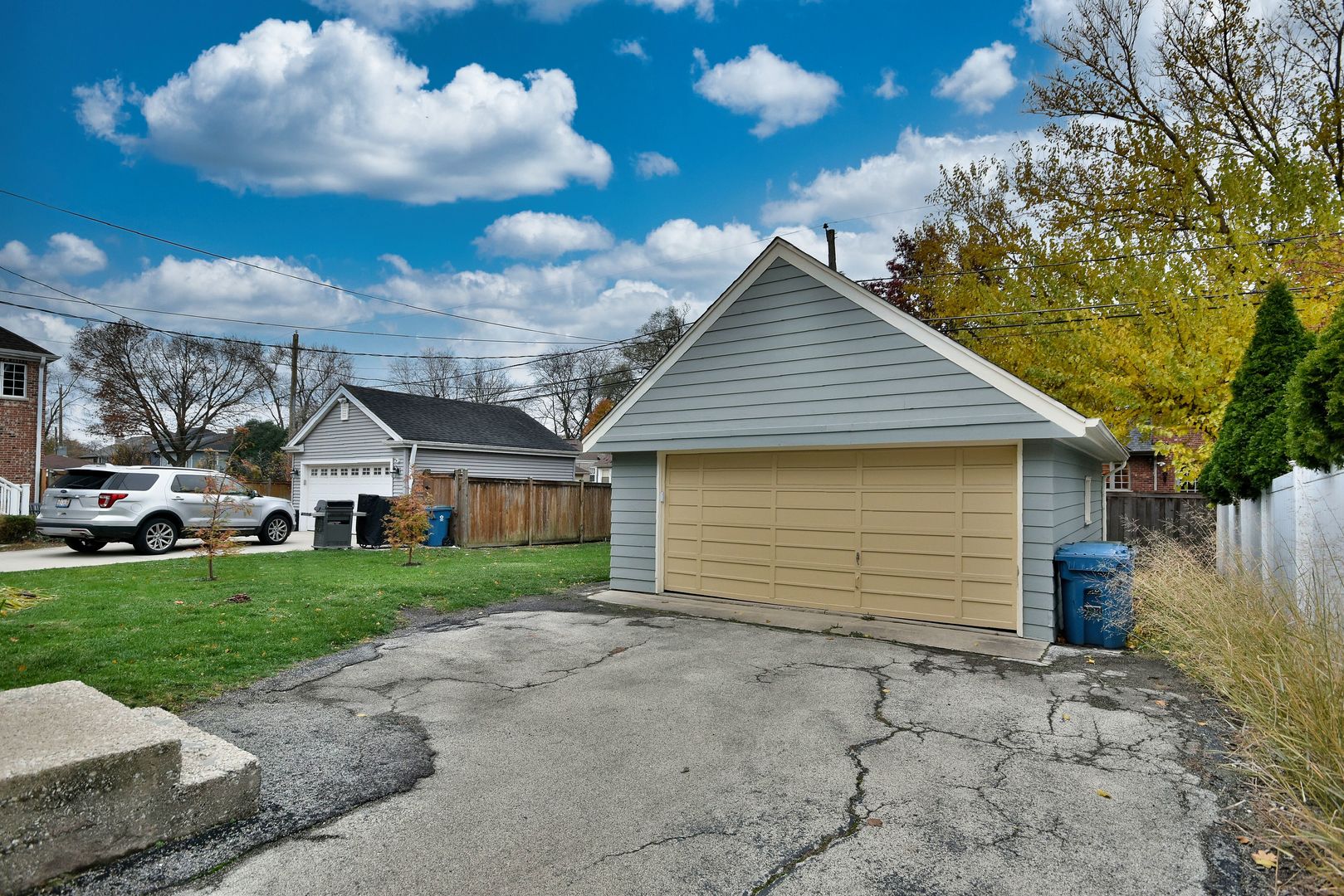632 Bryan Street Elmhurst, IL 60126 - Photo 29 of 33 a front view of a house with a yard and garage