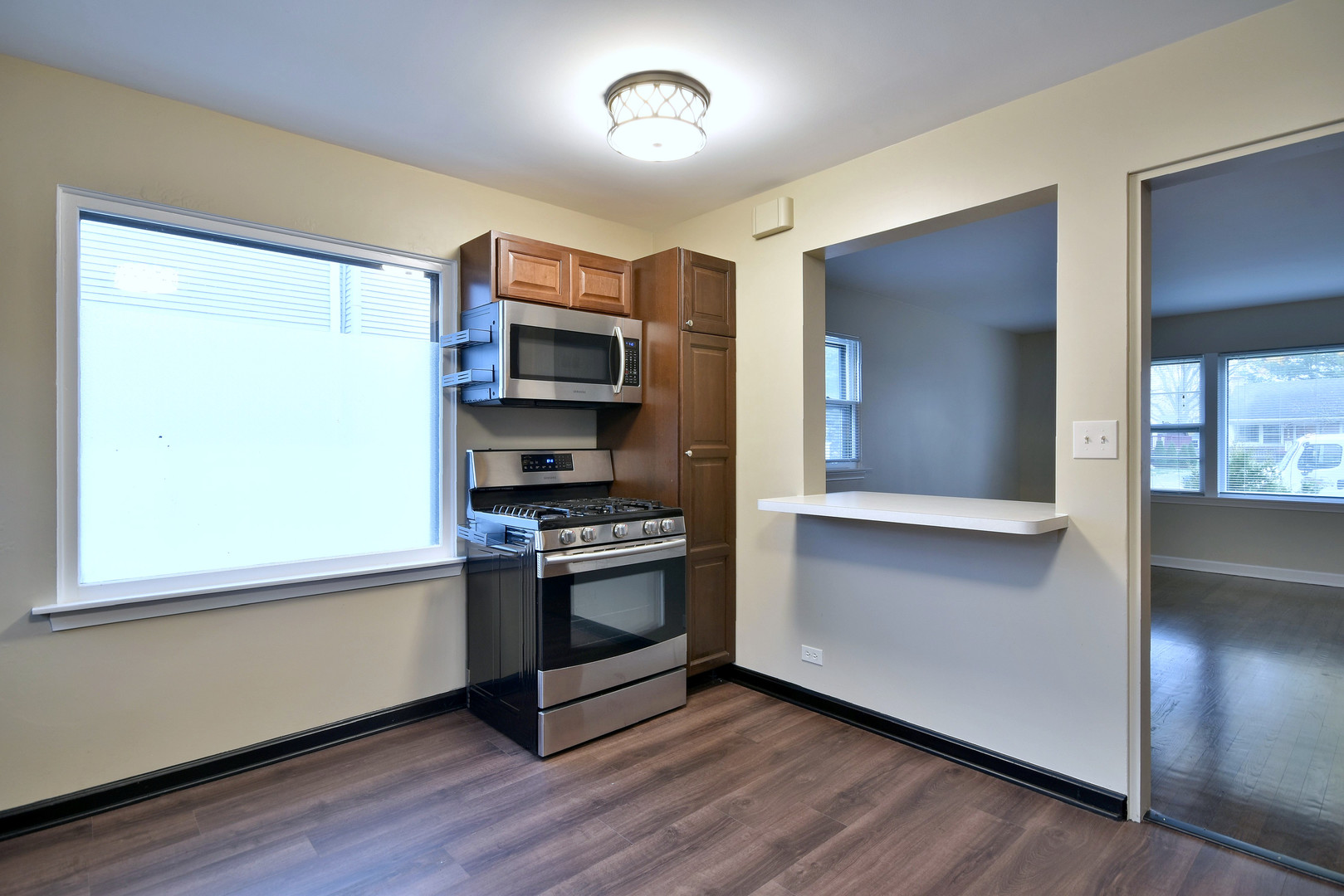 632 Bryan Street Elmhurst, IL 60126 - Photo 10 of 33 a kitchen with stainless steel appliances a refrigerator and a stove top oven