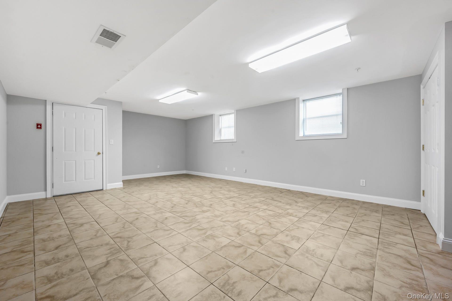 69 Ellsworth Avenue Harrison, NY 10528 - Photo 19 of 28 Basement featuring baseboards