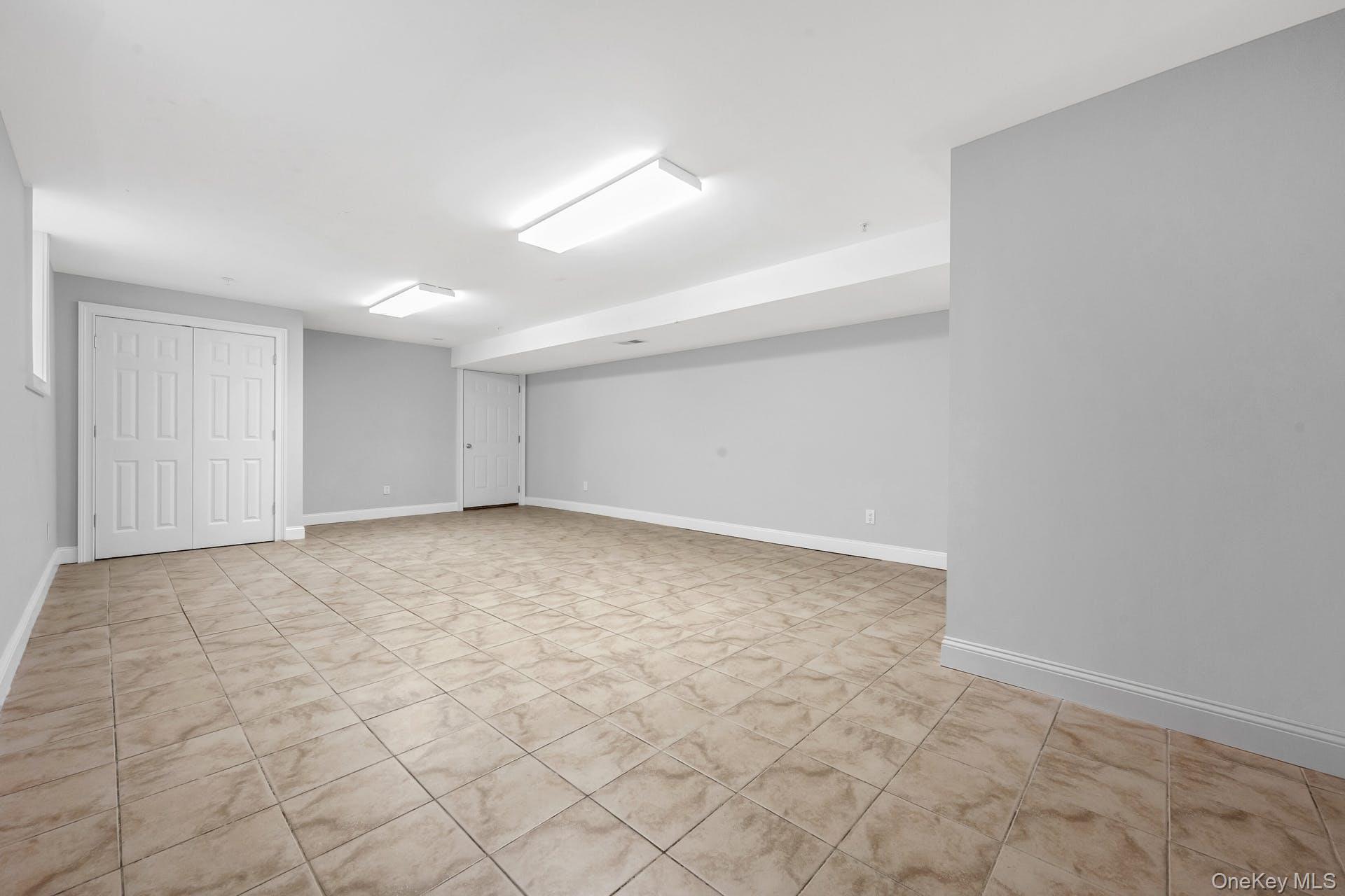 69 Ellsworth Avenue Harrison, NY 10528 - Photo 20 of 28 Finished below grade area featuring baseboards