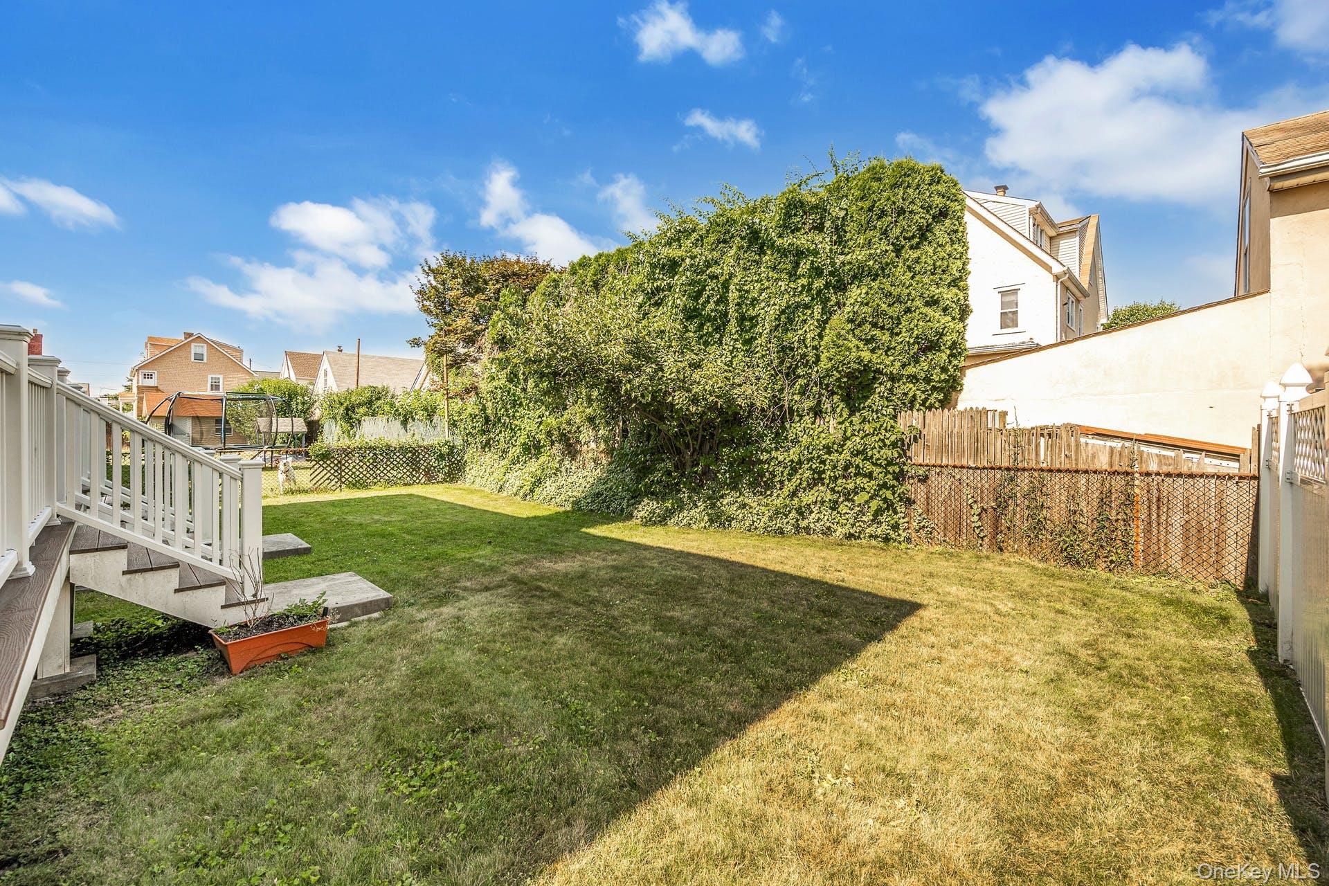 69 Ellsworth Avenue Harrison, NY 10528 - Photo 22 of 28 View of yard featuring a residential view