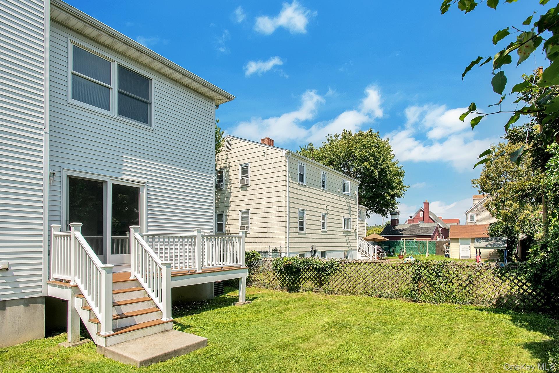 69 Ellsworth Avenue Harrison, NY 10528 - Photo 25 of 28 View of yard with a wooden deck