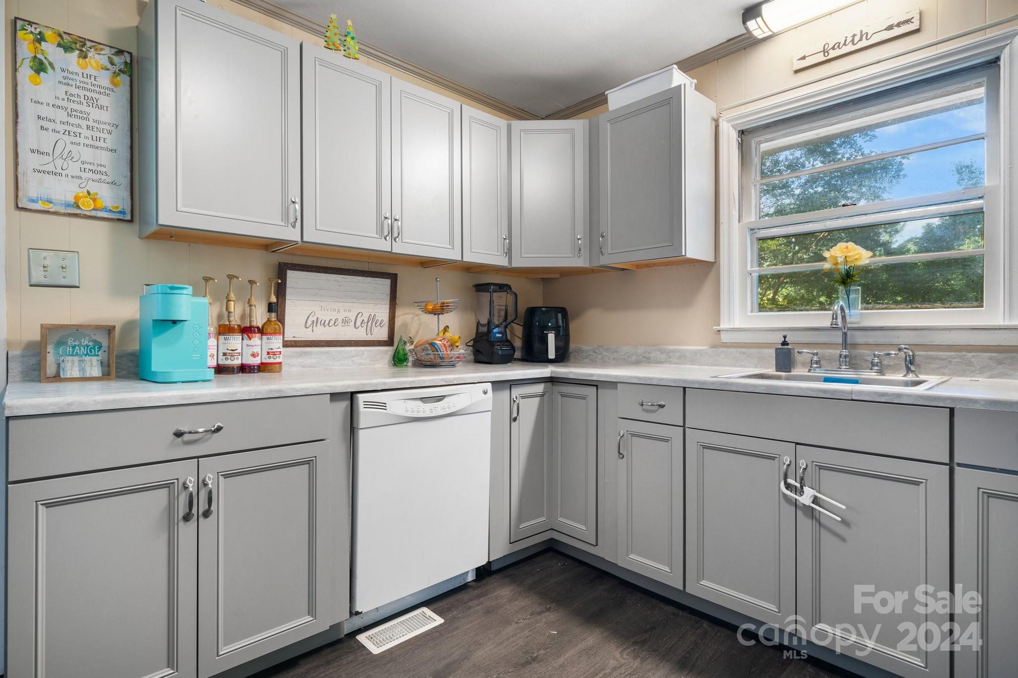 1675 Morningside Drive Newton, NC 28658 - Photo 13 of 36 a kitchen with white cabinets and sink