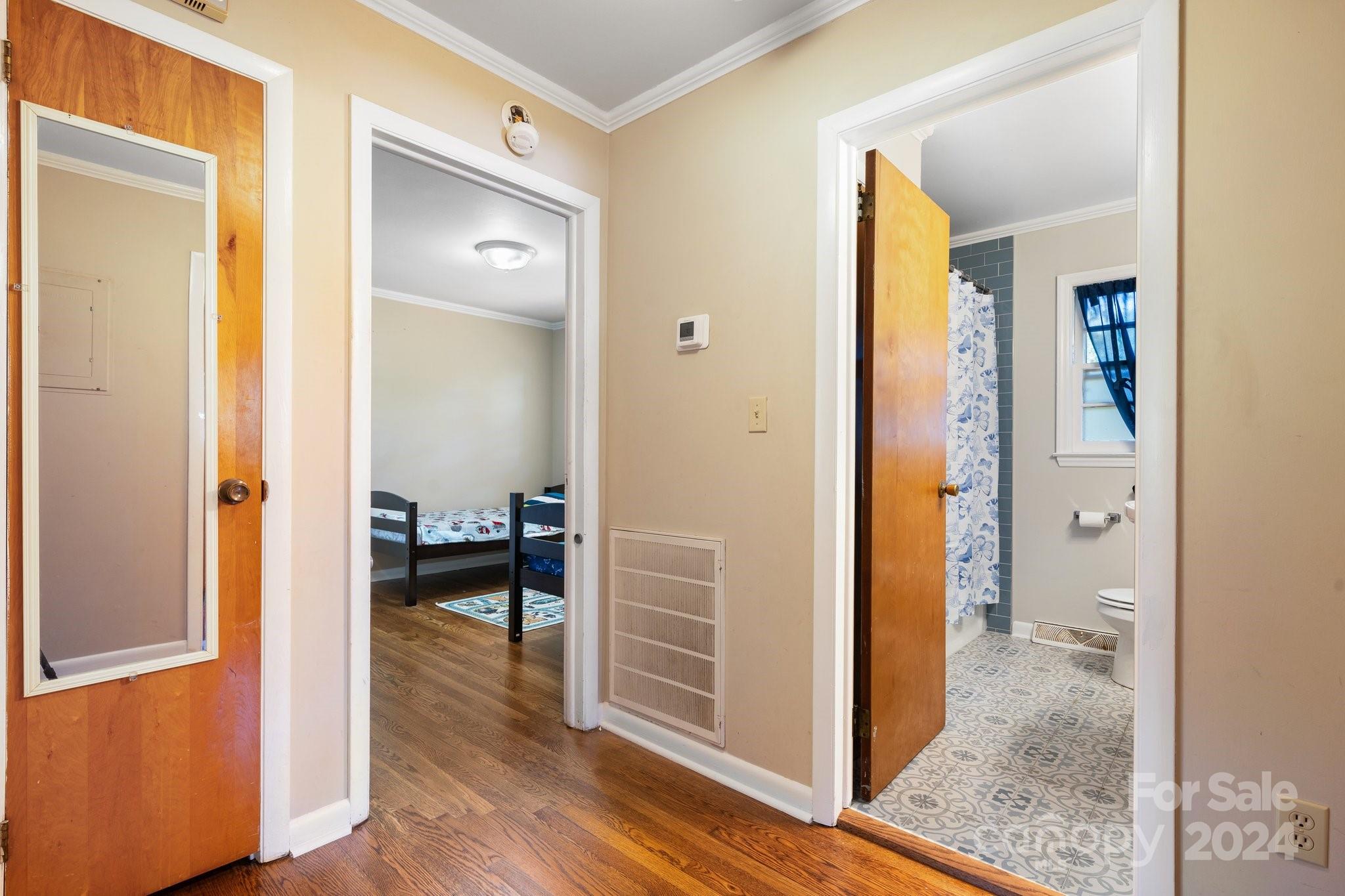 1675 Morningside Drive Newton, NC 28658 - Photo 18 of 36 a view of a hallway with wooden floor and a living room