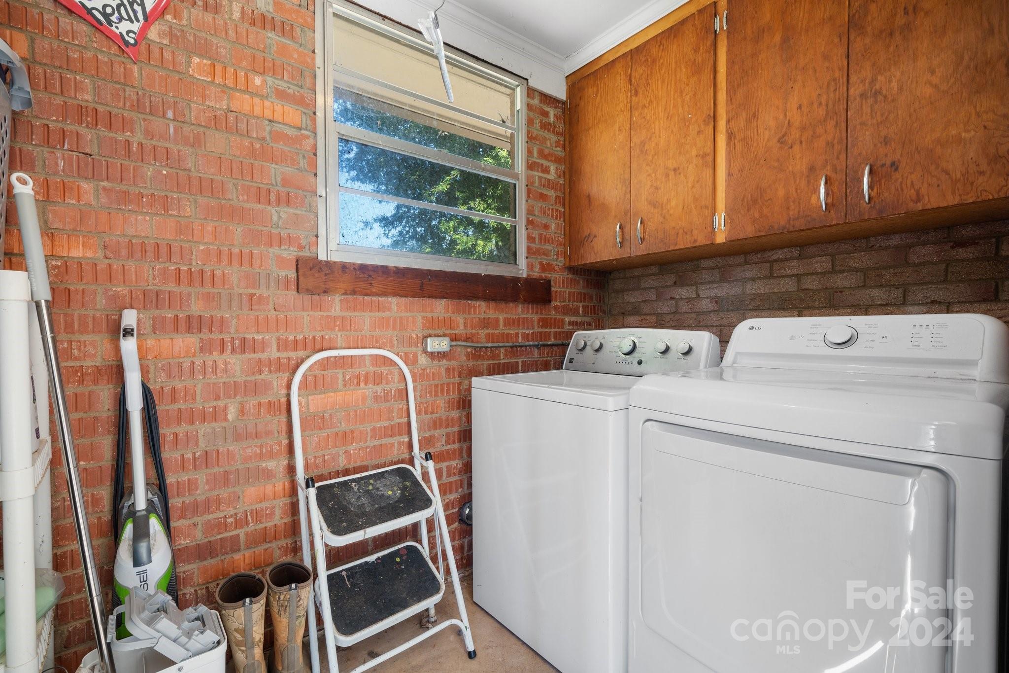 1675 Morningside Drive Newton, NC 28658 - Photo 21 of 36 a view of storage and utility room with washer and dryer
