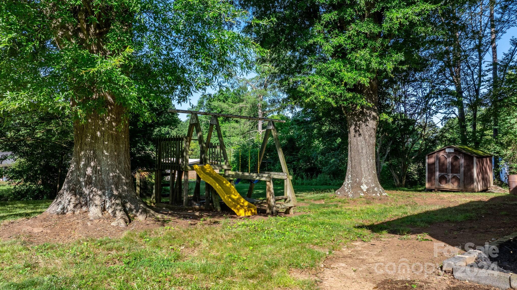 1675 Morningside Drive Newton, NC 28658 - Photo 22 of 36 a view of a backyard with swings