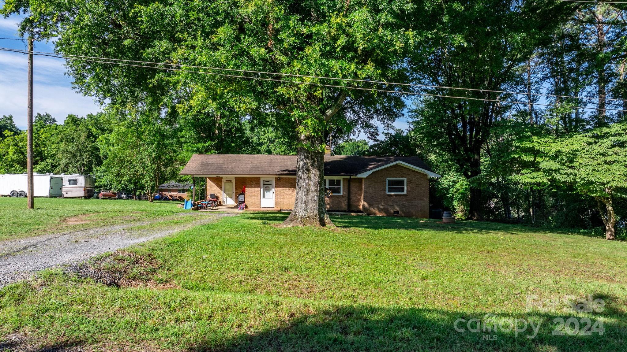 1675 Morningside Drive Newton, NC 28658 - Photo 3 of 36 a front view of a house with yard and green space