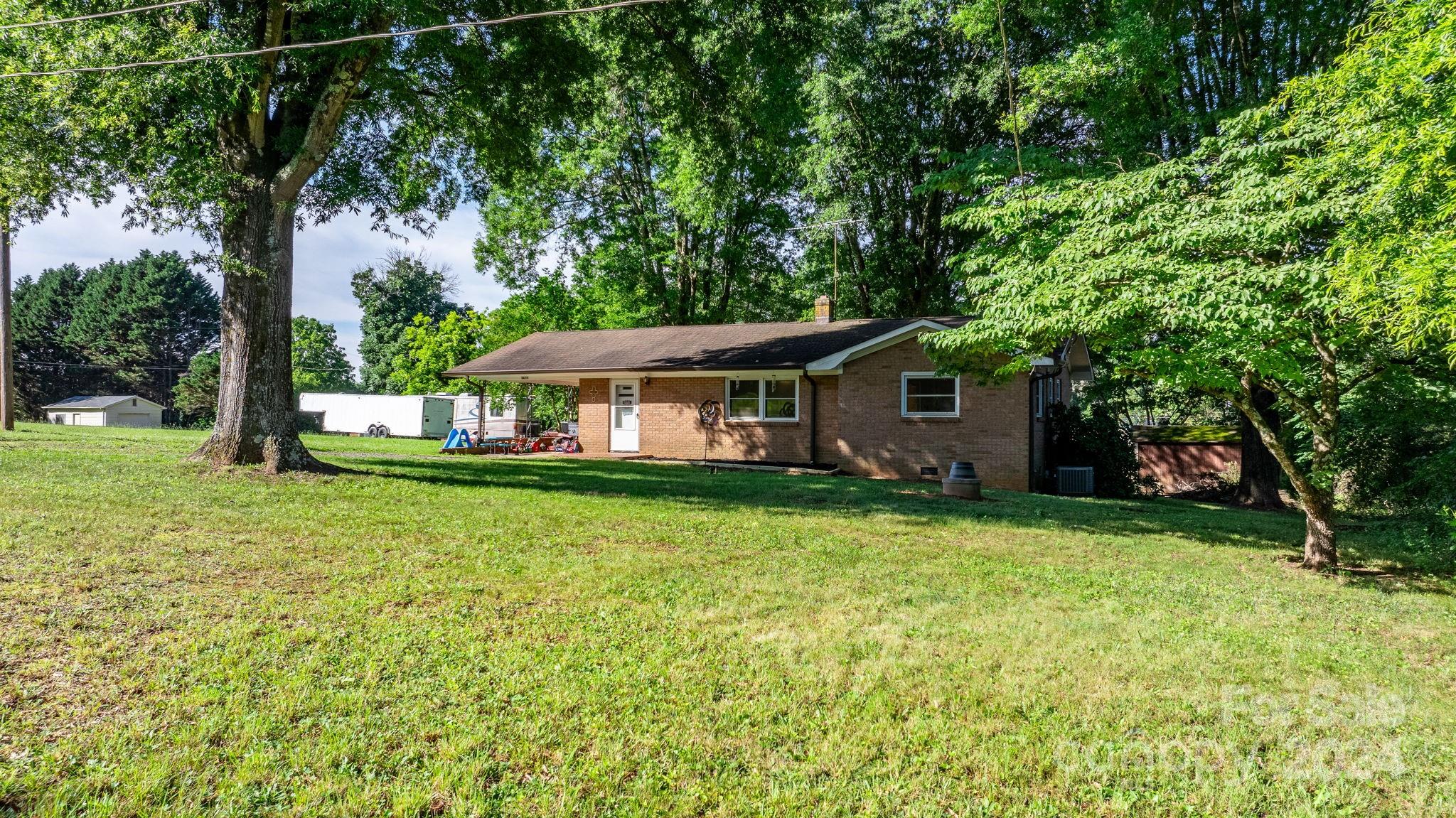 1675 Morningside Drive Newton, NC 28658 - Photo 4 of 36 a front view of a house with garden