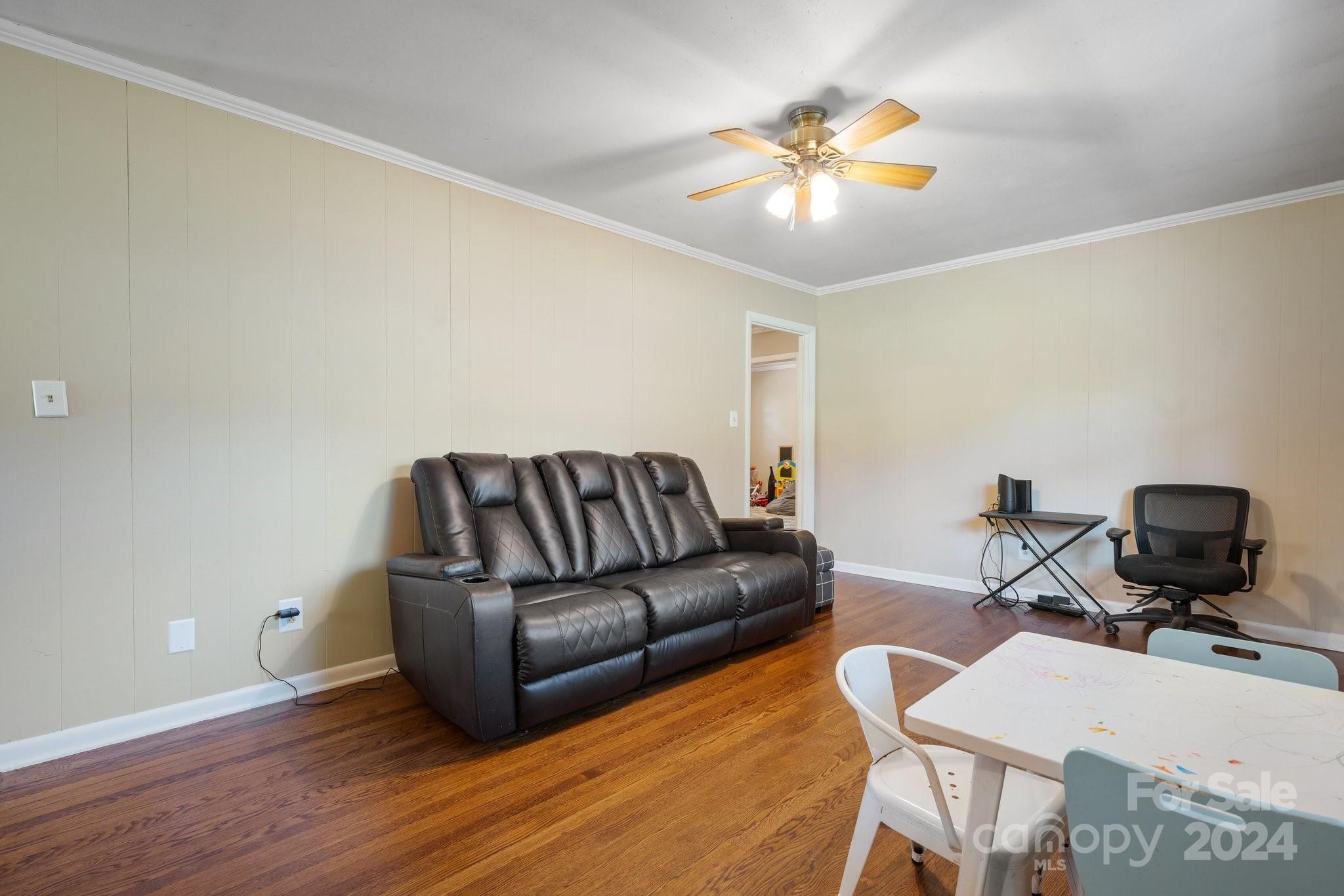 1675 Morningside Drive Newton, NC 28658 - Photo 8 of 36 a living room with furniture and a chandelier