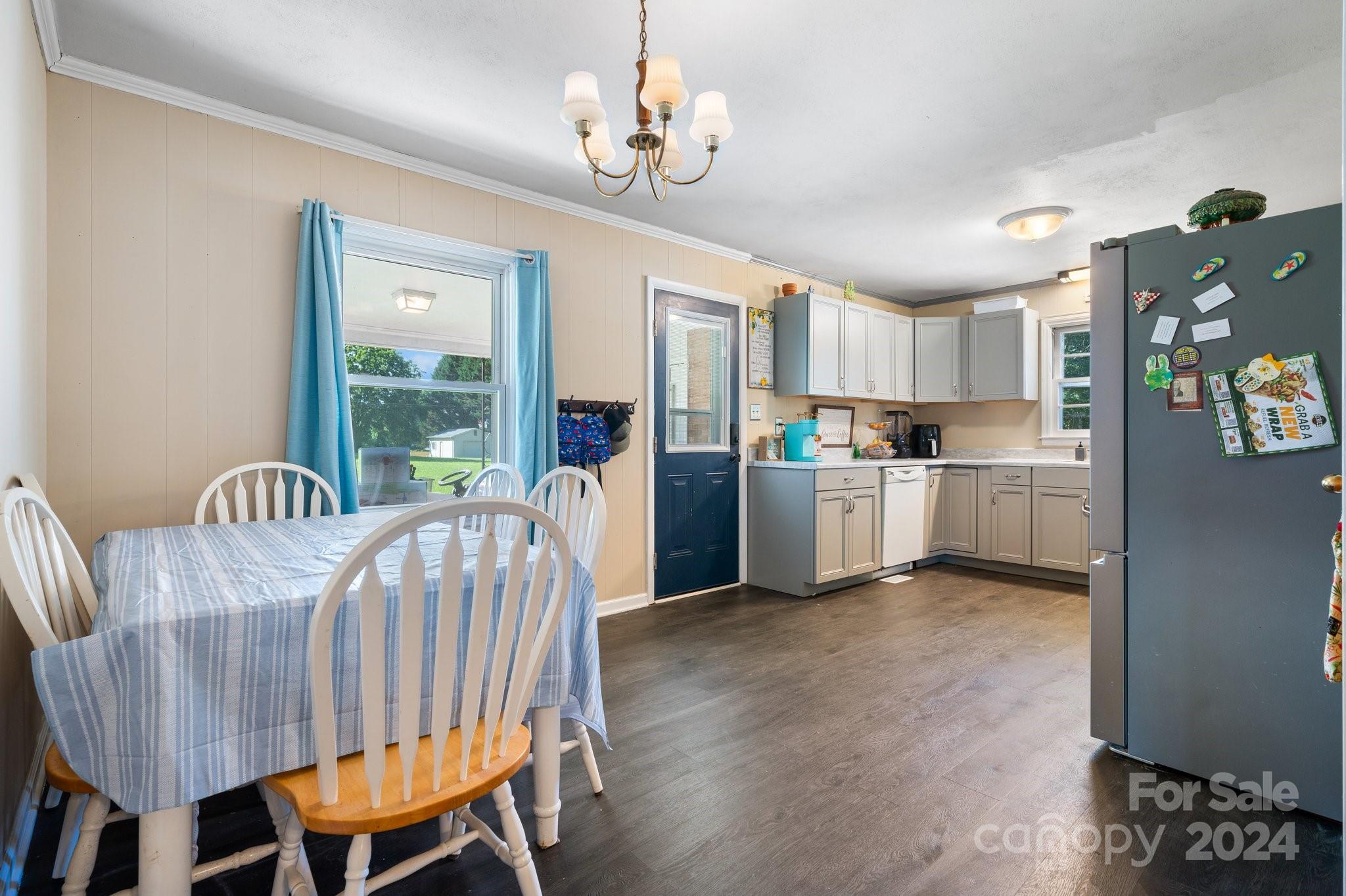 1675 Morningside Drive Newton, NC 28658 - Photo 9 of 36 a living room with stainless steel appliances kitchen island granite countertop furniture and a kitchen view