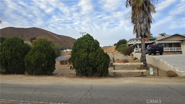 a view of a street with a building in the background