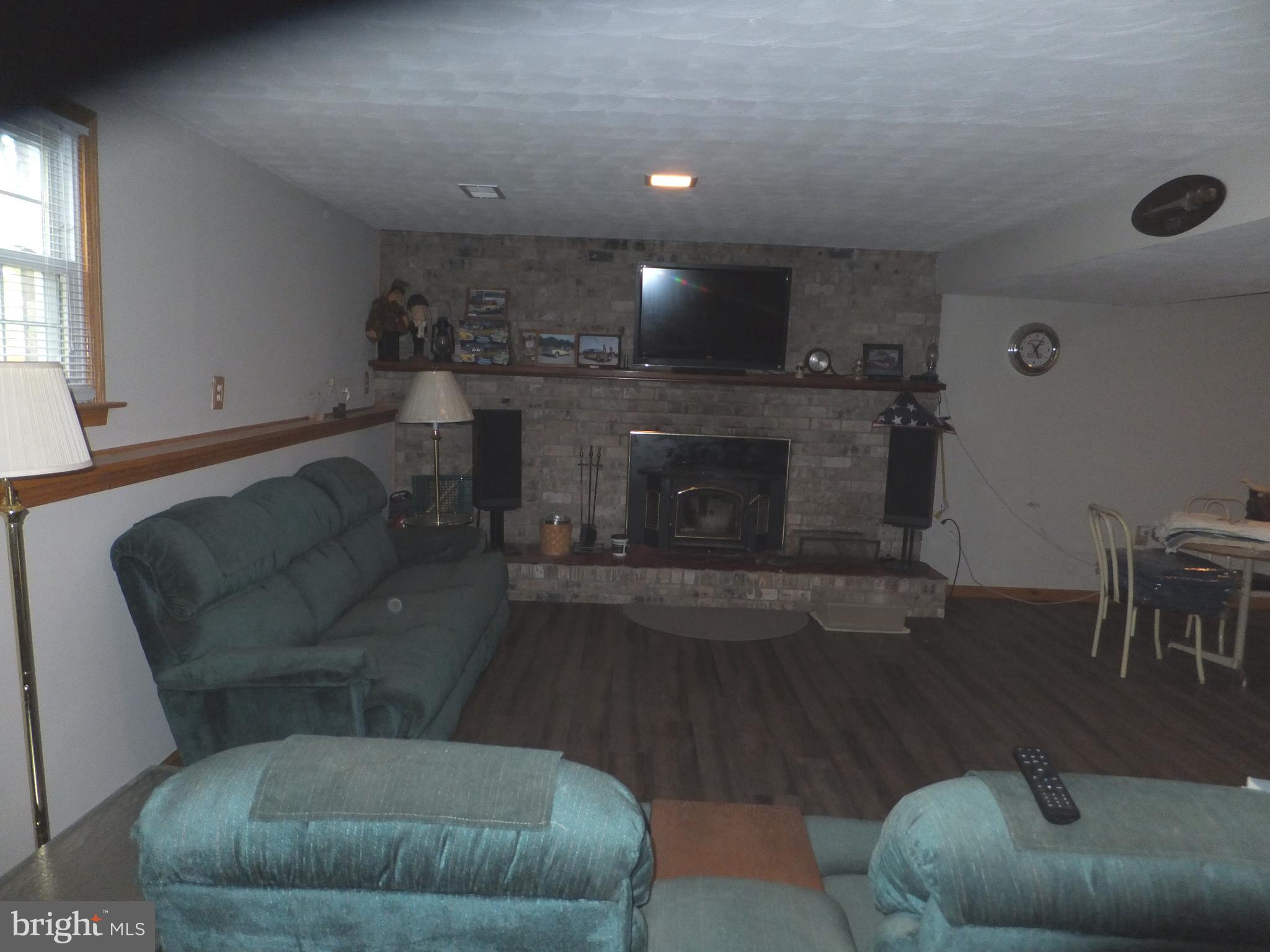 206 Eastern Road Pasadena, MD 21122 - Photo 50 of 57 FAMILY ROOM WITH WOOD BURNING FIREPLACE