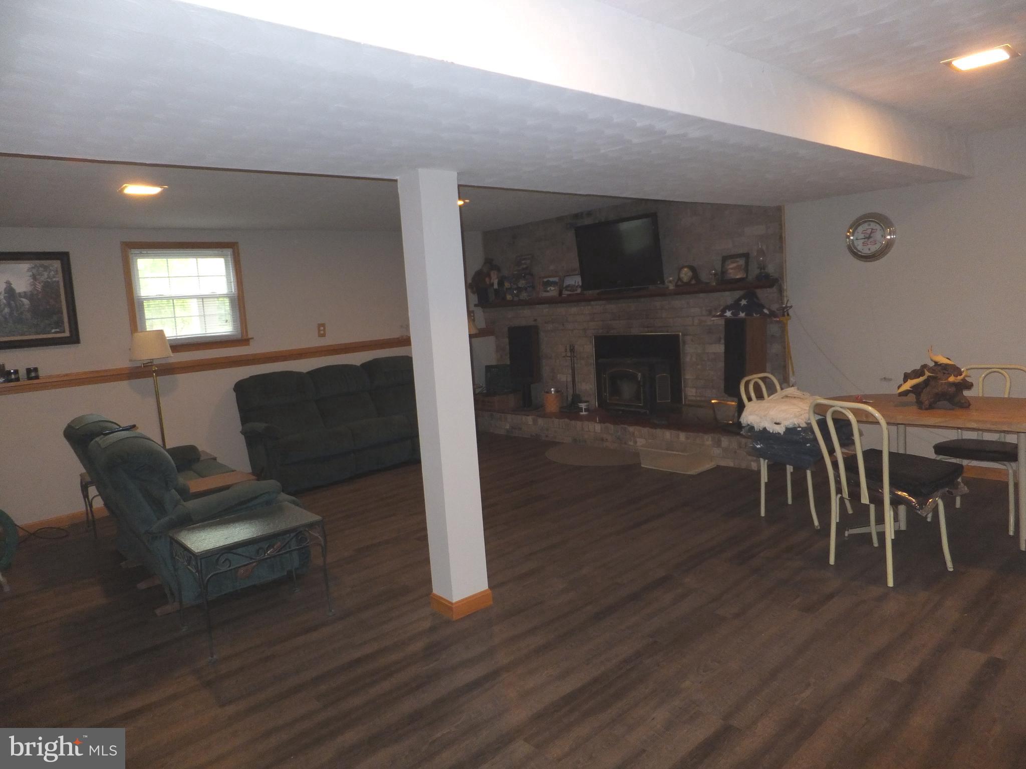 206 Eastern Road Pasadena, MD 21122 - Photo 54 of 57 FAMILY ROOM WITH UPGRADED LUXURY LTV FLOORING