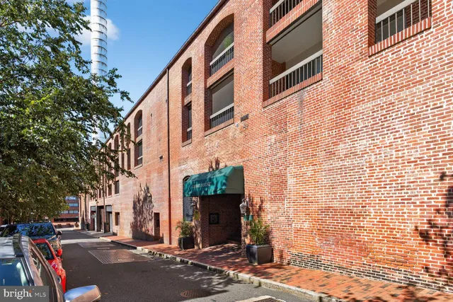 a brick building with a street