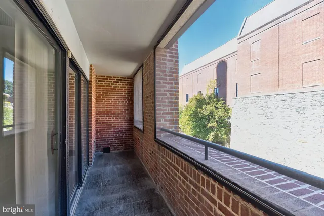 a view of a balcony with wooden floor and stairs