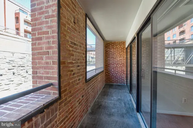 a view of a balcony with wooden floor