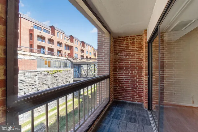 a view of a balcony with wooden floor