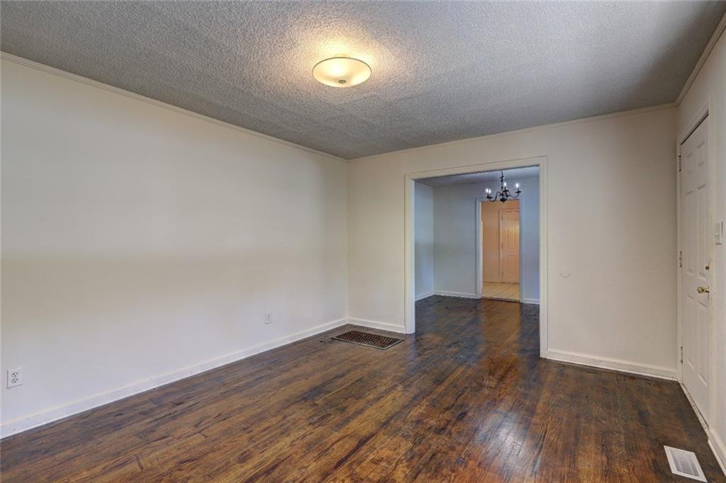 2128 Knightsbridge Road Macon, GA 31211 - Photo 4 of 12 a view of an empty room and wooden floor