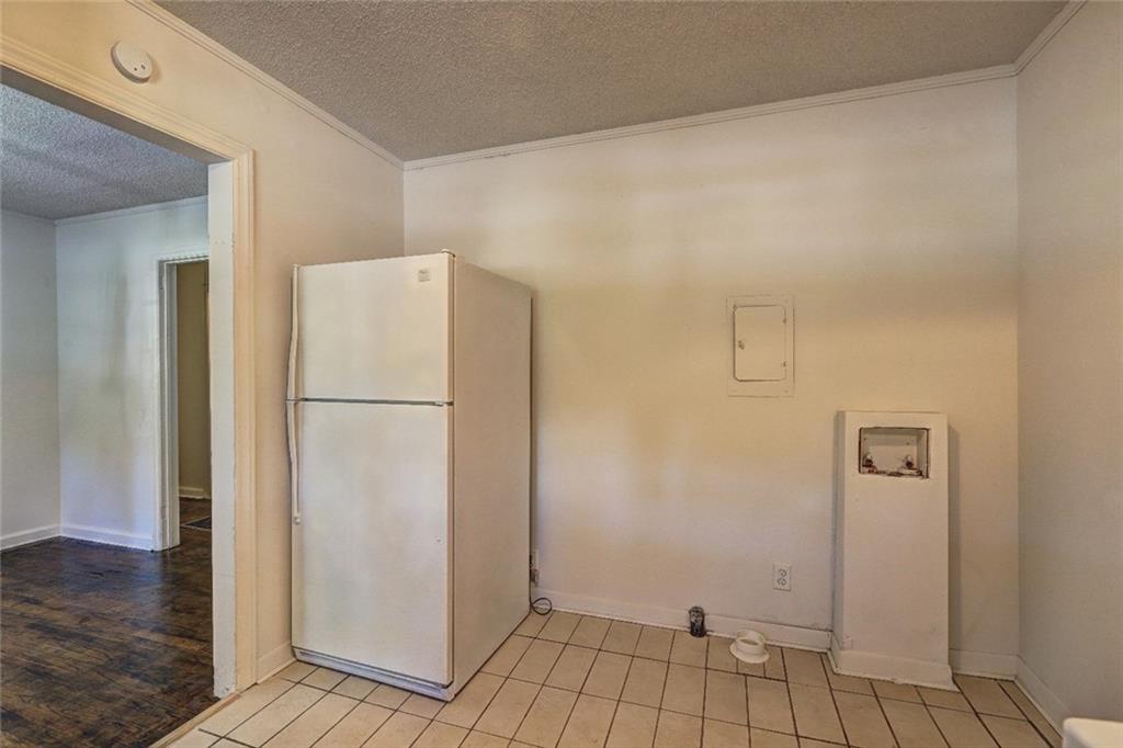 2128 Knightsbridge Road Macon, GA 31211 - Photo 6 of 12 a view of a kitchen with refrigerator and wooden floor