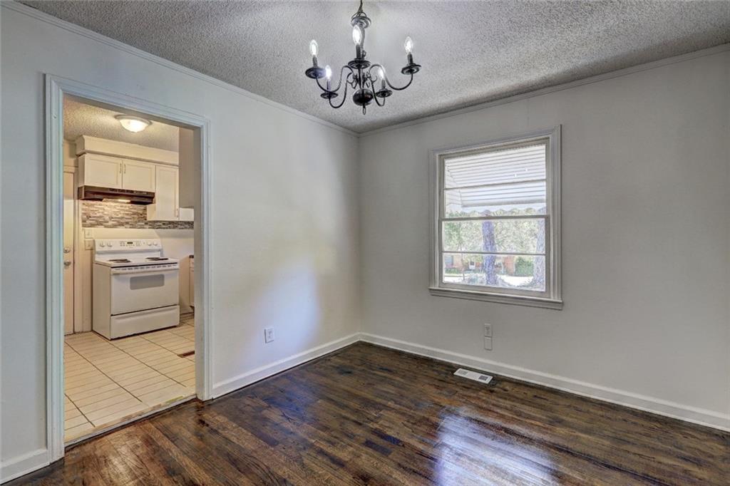 2128 Knightsbridge Road Macon, GA 31211 - Photo 10 of 12 a view of a kitchen with a sink a refrigerator and window