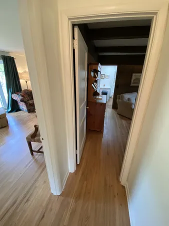 a bedroom with a bed couch and a dresser