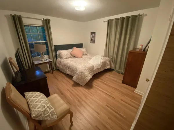 a bedroom with a bed and a walk in closet