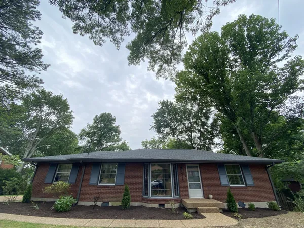 a front view of a house with garage