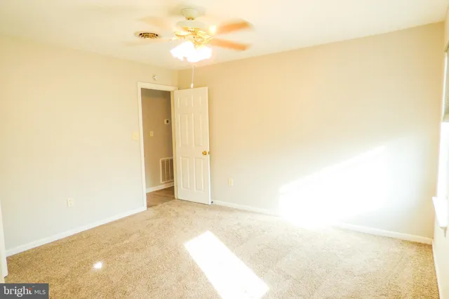 a view of a big room with carpet