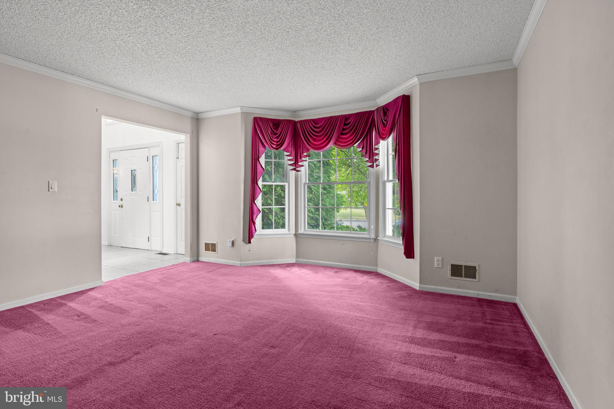 18 Lea Drive Hamilton, NJ 08690 - Photo 11 of 44 a view of a room with a large window and wooden floor