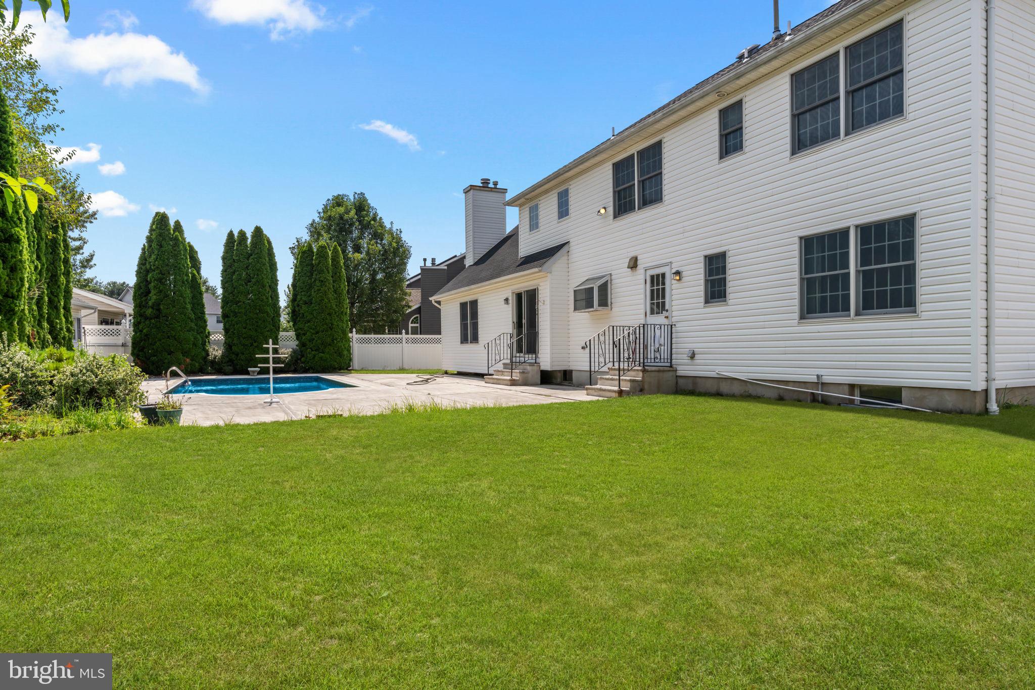 18 Lea Drive Hamilton, NJ 08690 - Photo 44 of 44 a front view of house with yard and outdoor seating