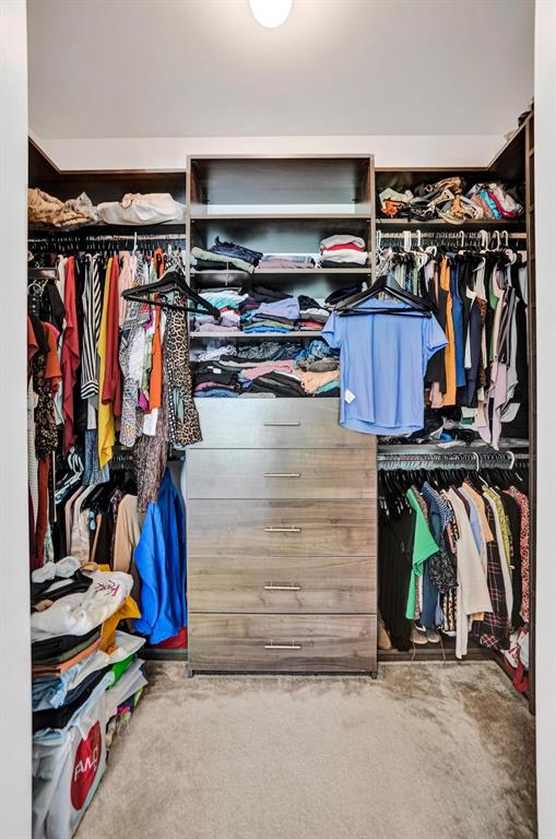 480 Northeast 35th Court, Unit 2 Oakland Park, FL 33334 - Photo 14 of 35 a view of walk in closet with clothes and shoes