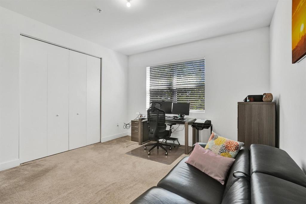 480 Northeast 35th Court, Unit 2 Oakland Park, FL 33334 - Photo 21 of 35 a living room with furniture and a window