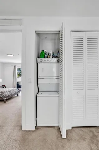 a utility room with closet dryer and washer