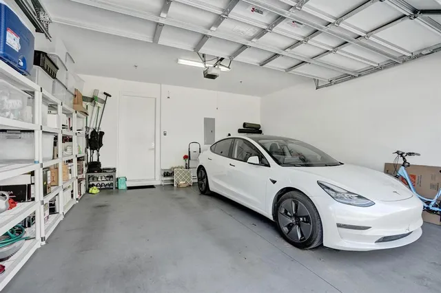 a car and bike parked in a garage