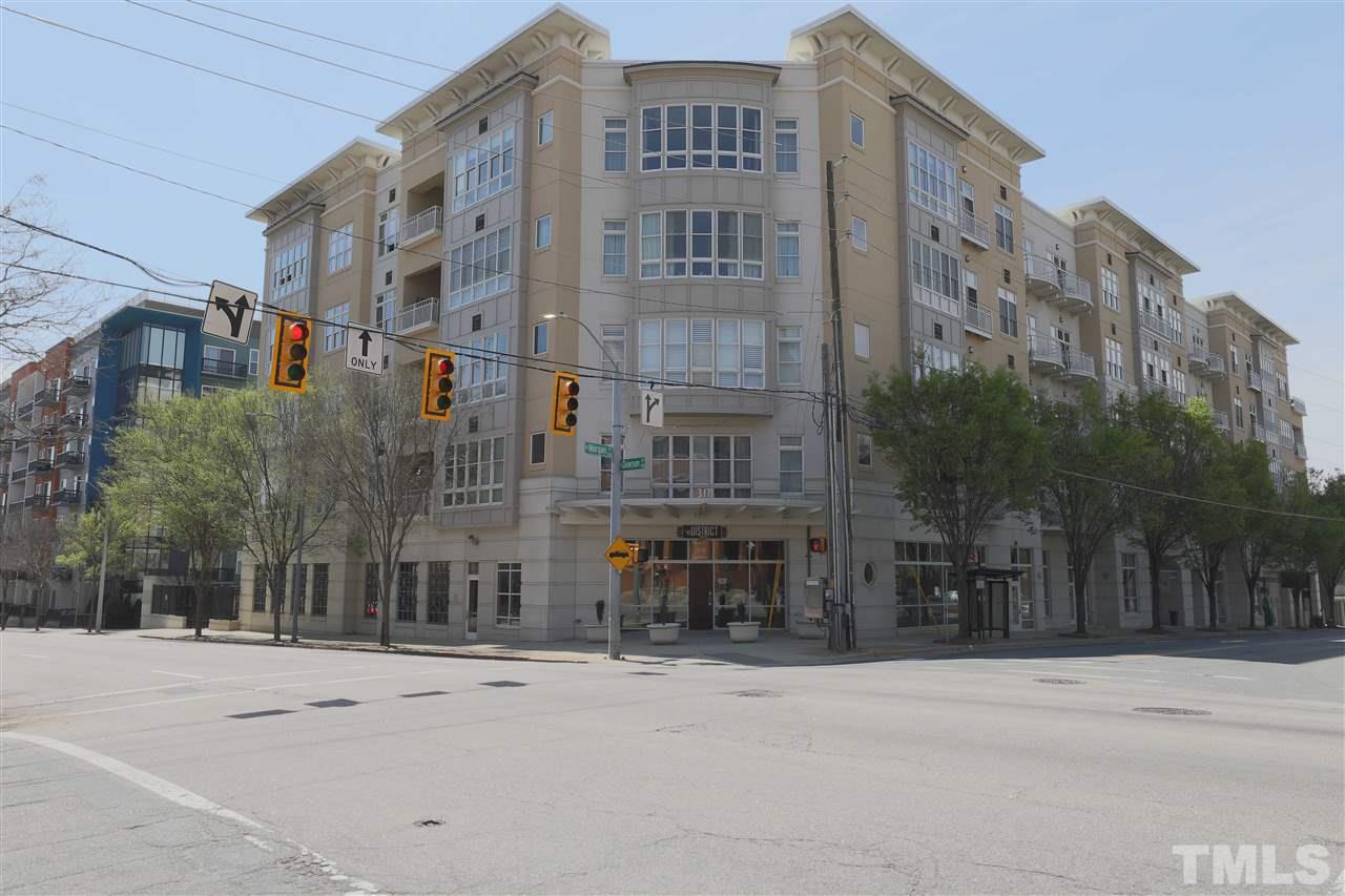 317 West Morgan Street, Unit 412 Raleigh, NC 27601 - Photo 2 of 25 a city street lined with tall buildings