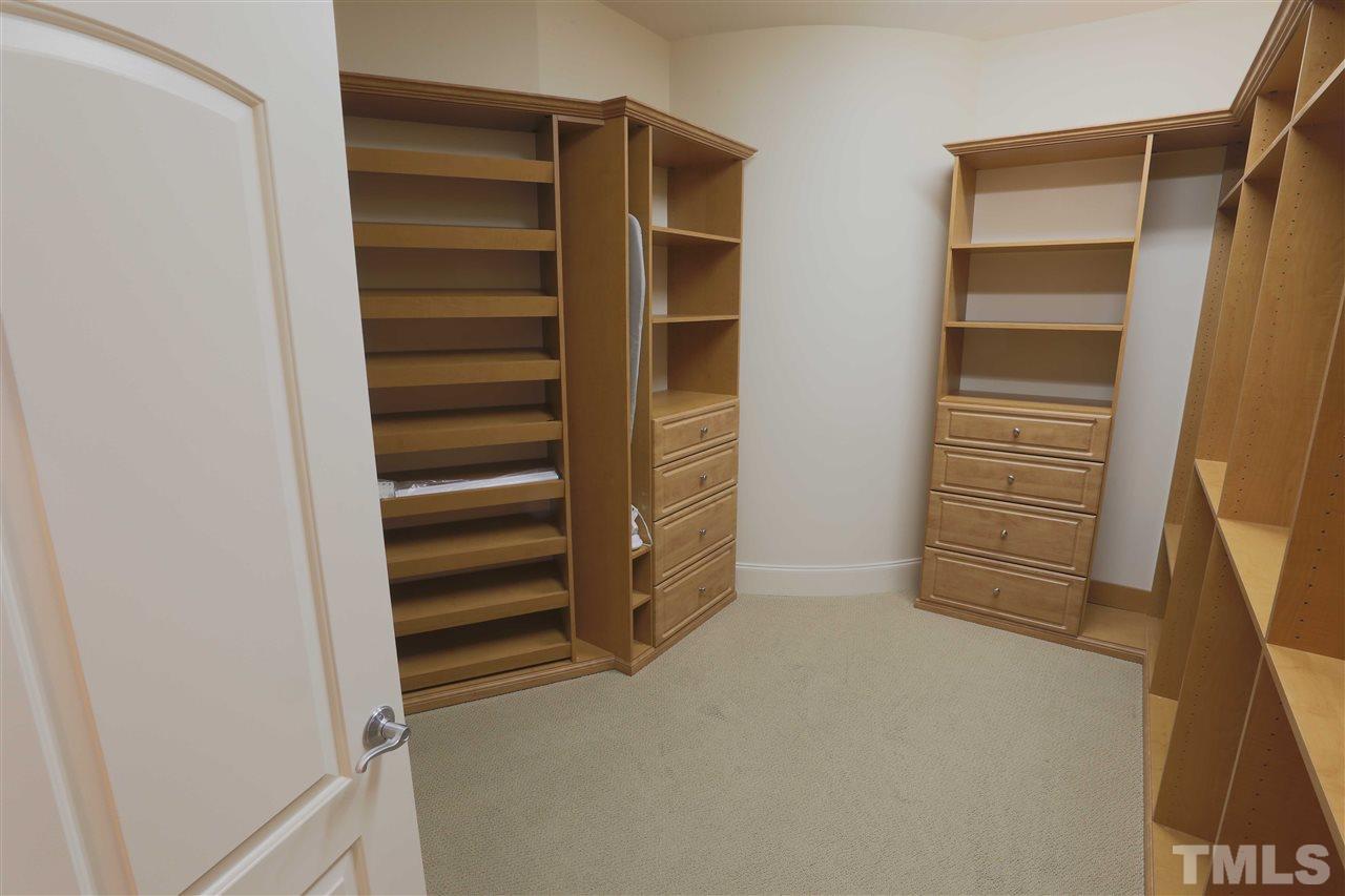 317 West Morgan Street, Unit 412 Raleigh, NC 27601 - Photo 12 of 25 a view of walk in closet with empty racks
