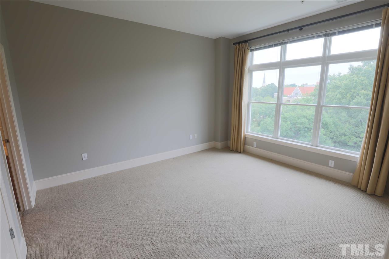 317 West Morgan Street, Unit 412 Raleigh, NC 27601 - Photo 16 of 25 a view of an empty room with a window