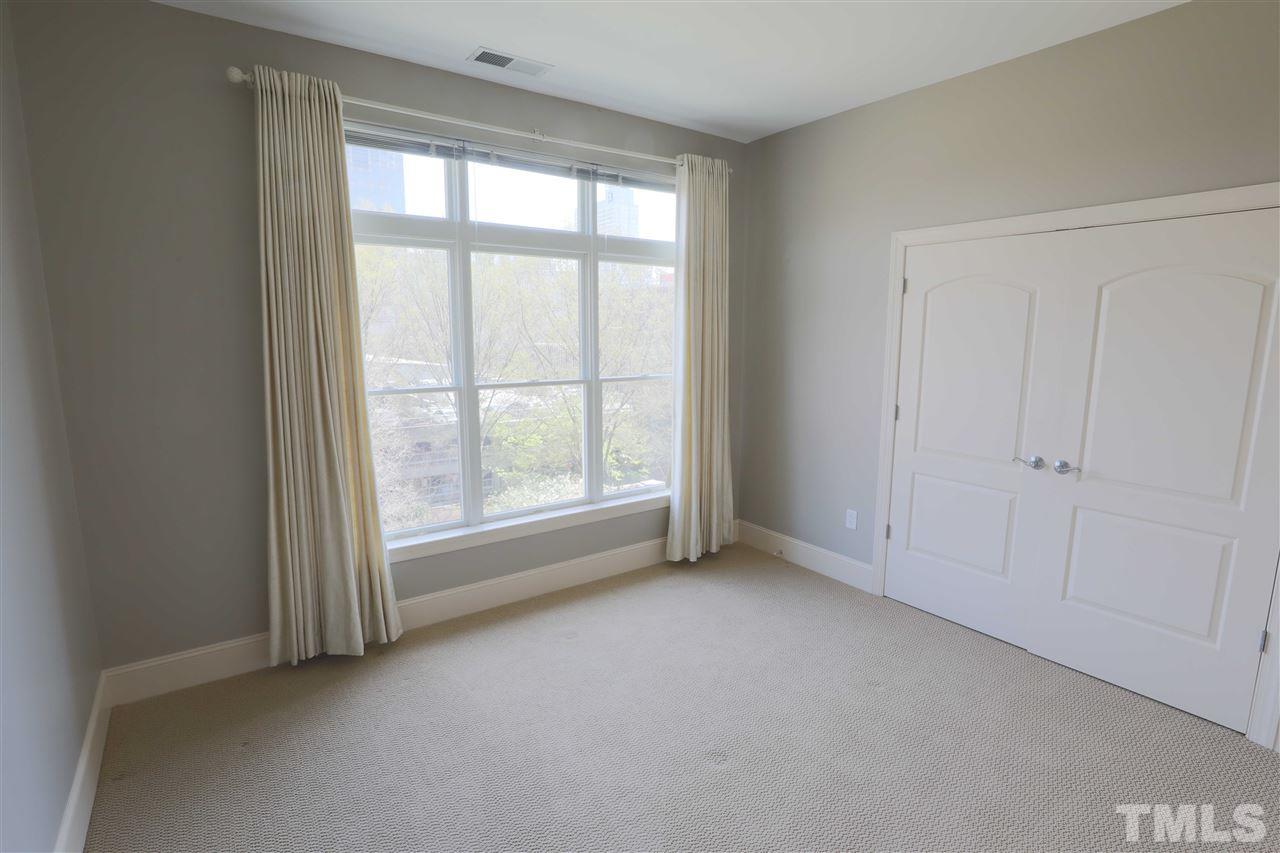 317 West Morgan Street, Unit 412 Raleigh, NC 27601 - Photo 18 of 25 an empty room with a window