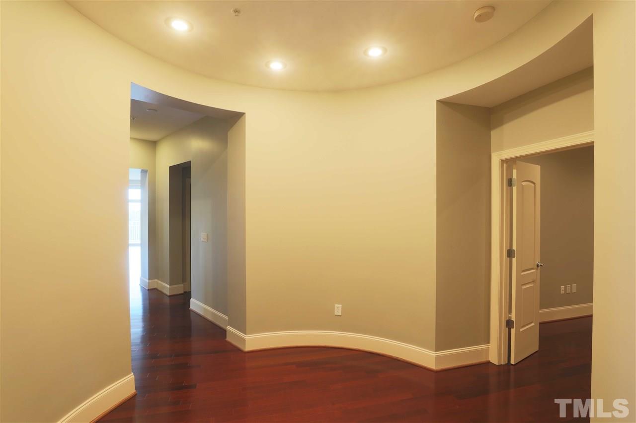 317 West Morgan Street, Unit 412 Raleigh, NC 27601 - Photo 10 of 25 a view of a hallway with wooden floor