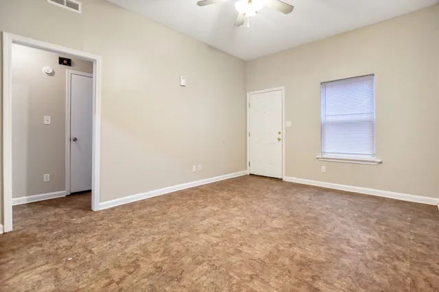 a view of an empty room with a window
