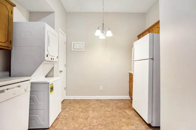 a view of a kitchen from the hallway