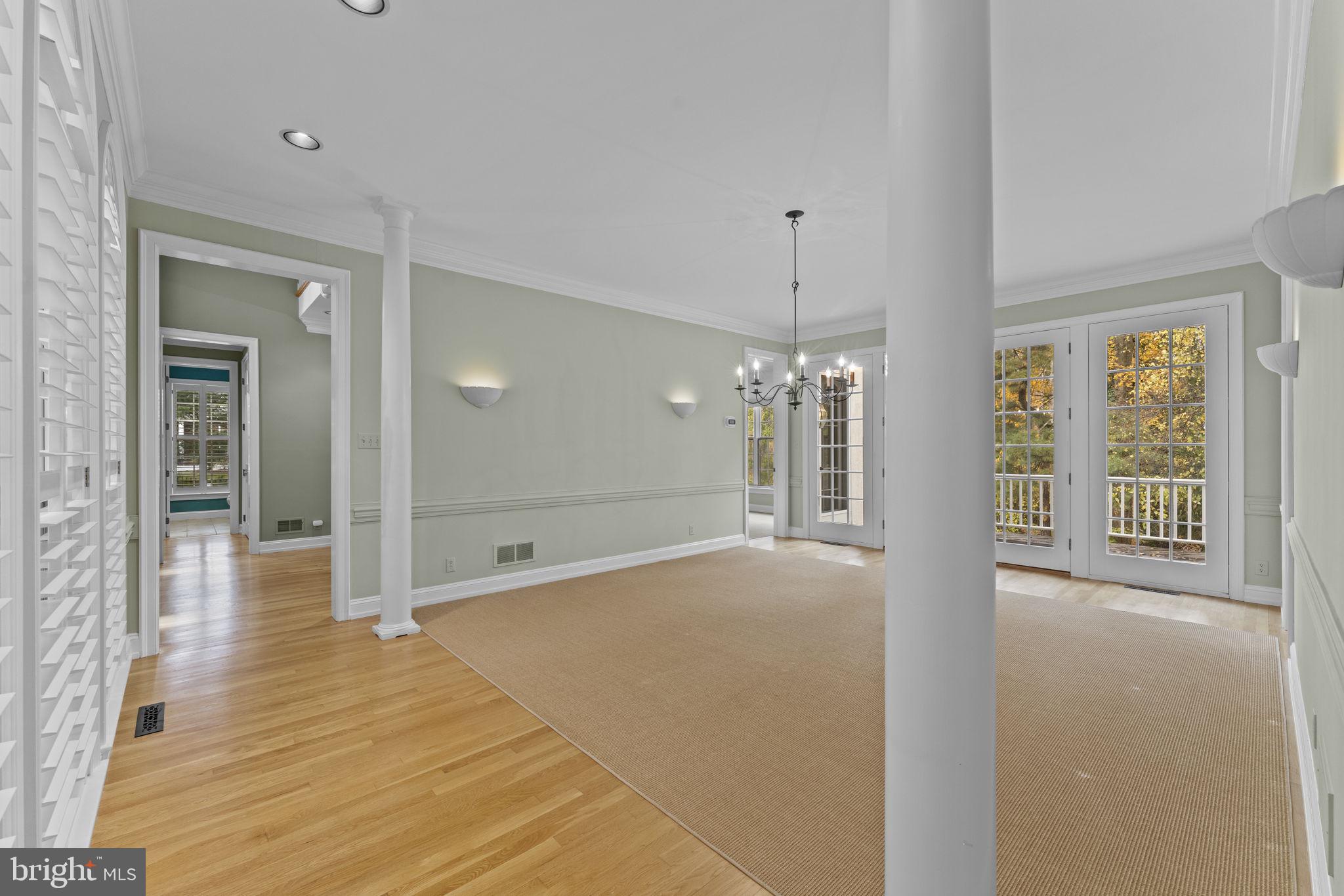 841 Mt Moro Road Villanova, PA 19085 - Photo 12 of 63 a view of a hallway with wooden floor and chandelier