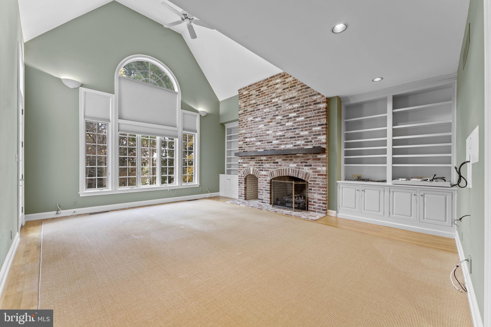 841 Mt Moro Road Villanova, PA 19085 - Photo 13 of 63 a view of an empty room with a fireplace and a window
