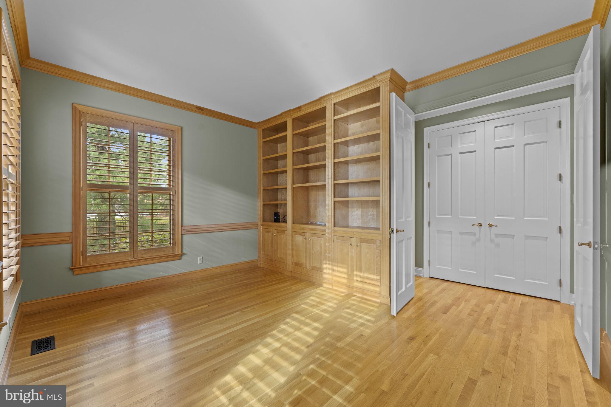 841 Mt Moro Road Villanova, PA 19085 - Photo 22 of 63 a view of an empty room with wooden floor and a window