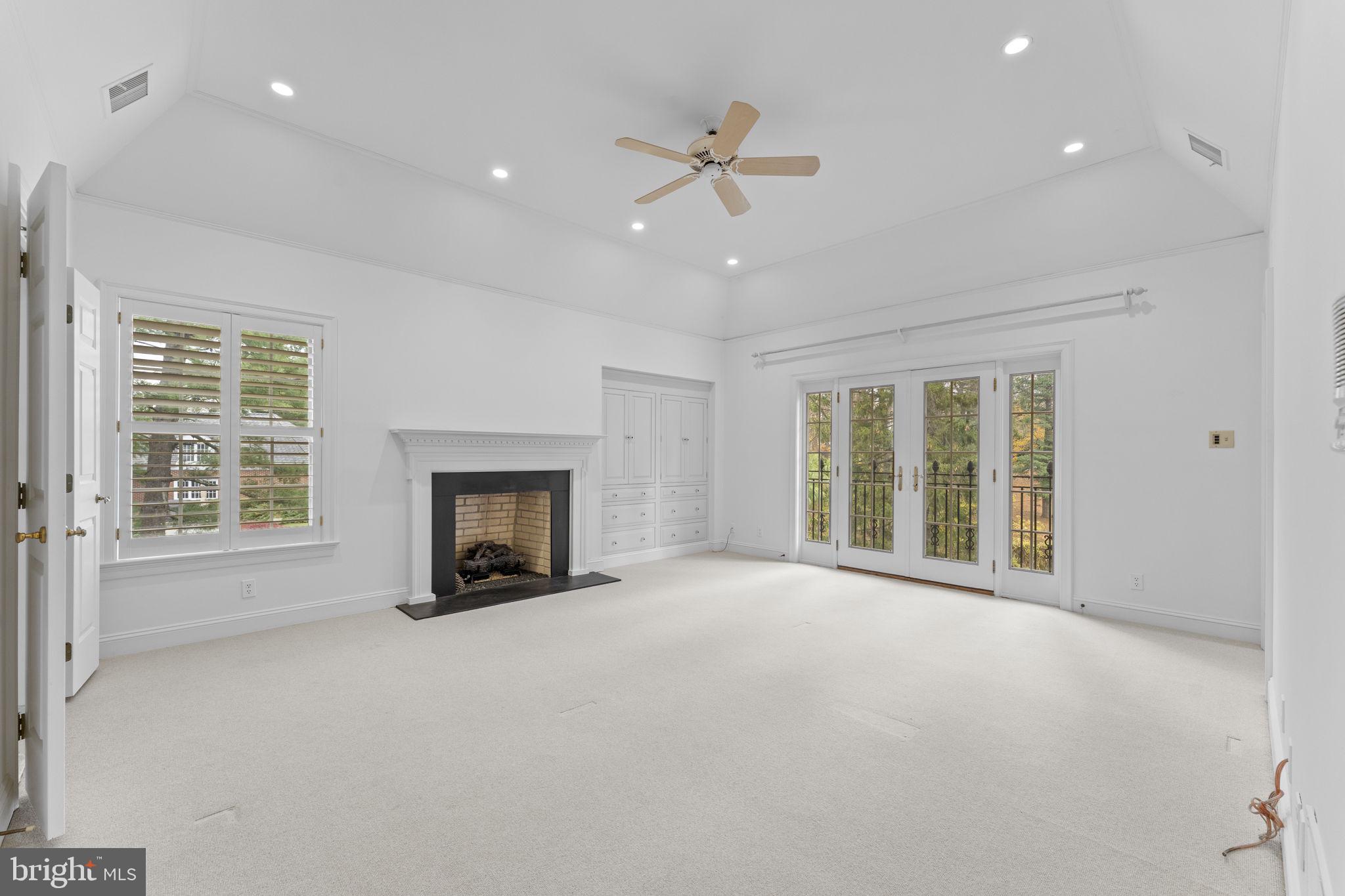 841 Mt Moro Road Villanova, PA 19085 - Photo 26 of 63 a view of an empty room with a fireplace and a window