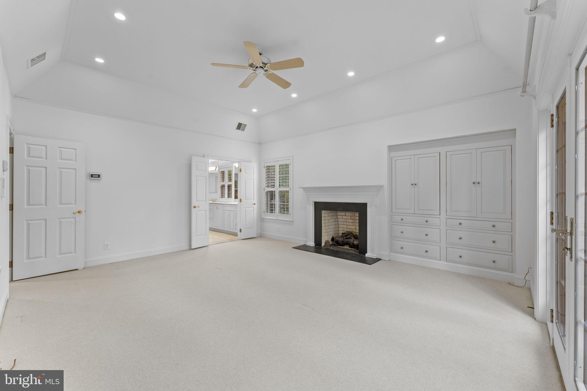 841 Mt Moro Road Villanova, PA 19085 - Photo 27 of 63 an empty room with fireplace and windows