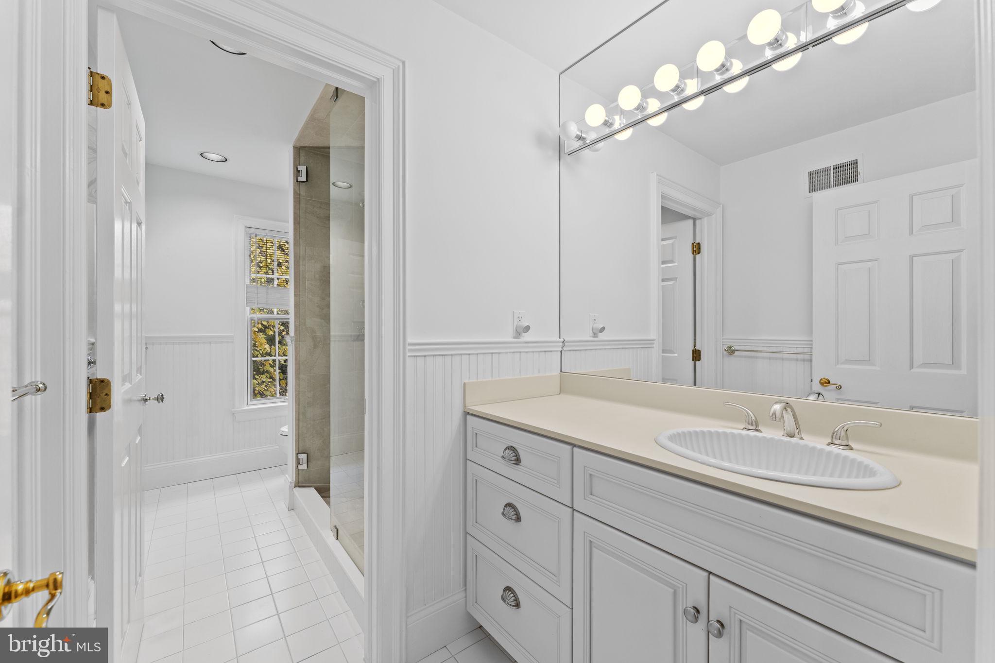 841 Mt Moro Road Villanova, PA 19085 - Photo 33 of 63 a bathroom with a sink double vanity and a mirror