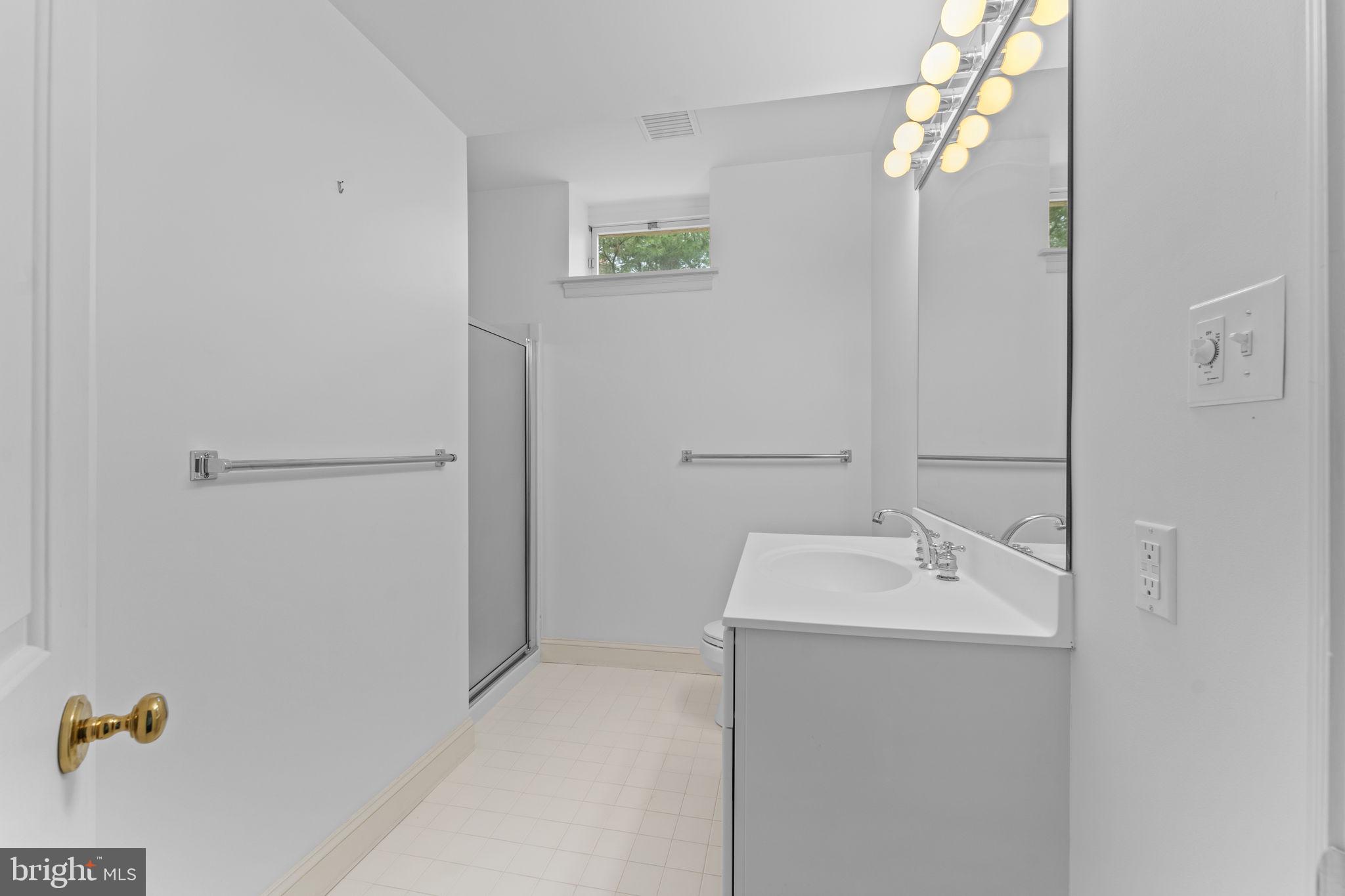 841 Mt Moro Road Villanova, PA 19085 - Photo 40 of 63 a bathroom with a sink a mirror and shower